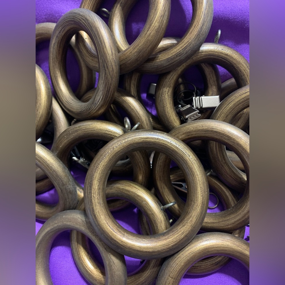 30 pieces curtain holder with the clips. Color bronze, they are not heavy.